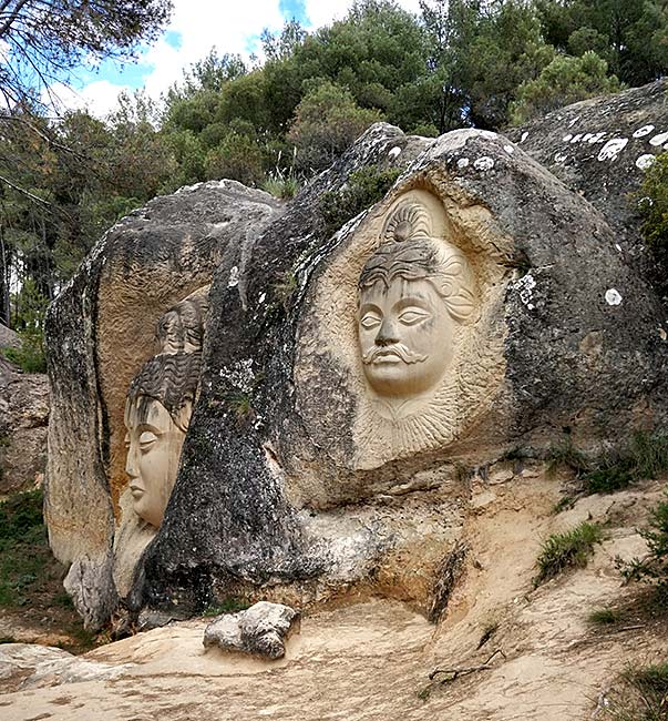 Sculptures of Maitreya and Arujuna on Ruta de las Caras in Spain
